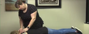 Chiropractor Dr. Adrienne Owens performing a manual adjustment.